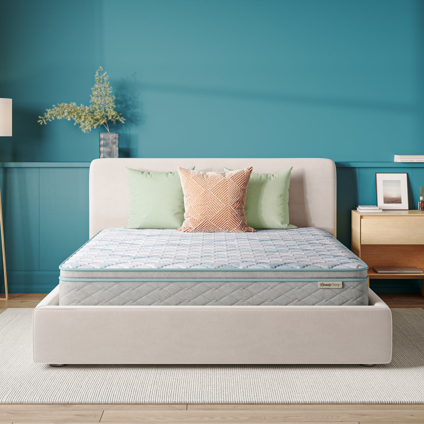 Beautysleep Mattress in a grey bedframe with 3 pillows on top of it within a bedroom setting