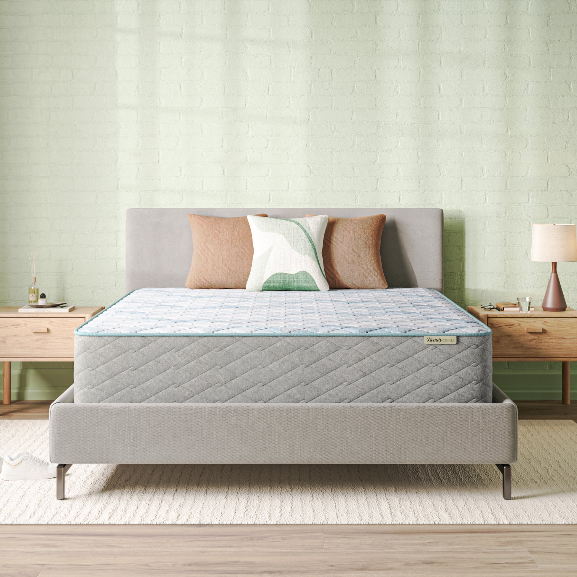Beautysleep Mattress in a grey bedframe with 3 pillows on top of it within a bedroom setting