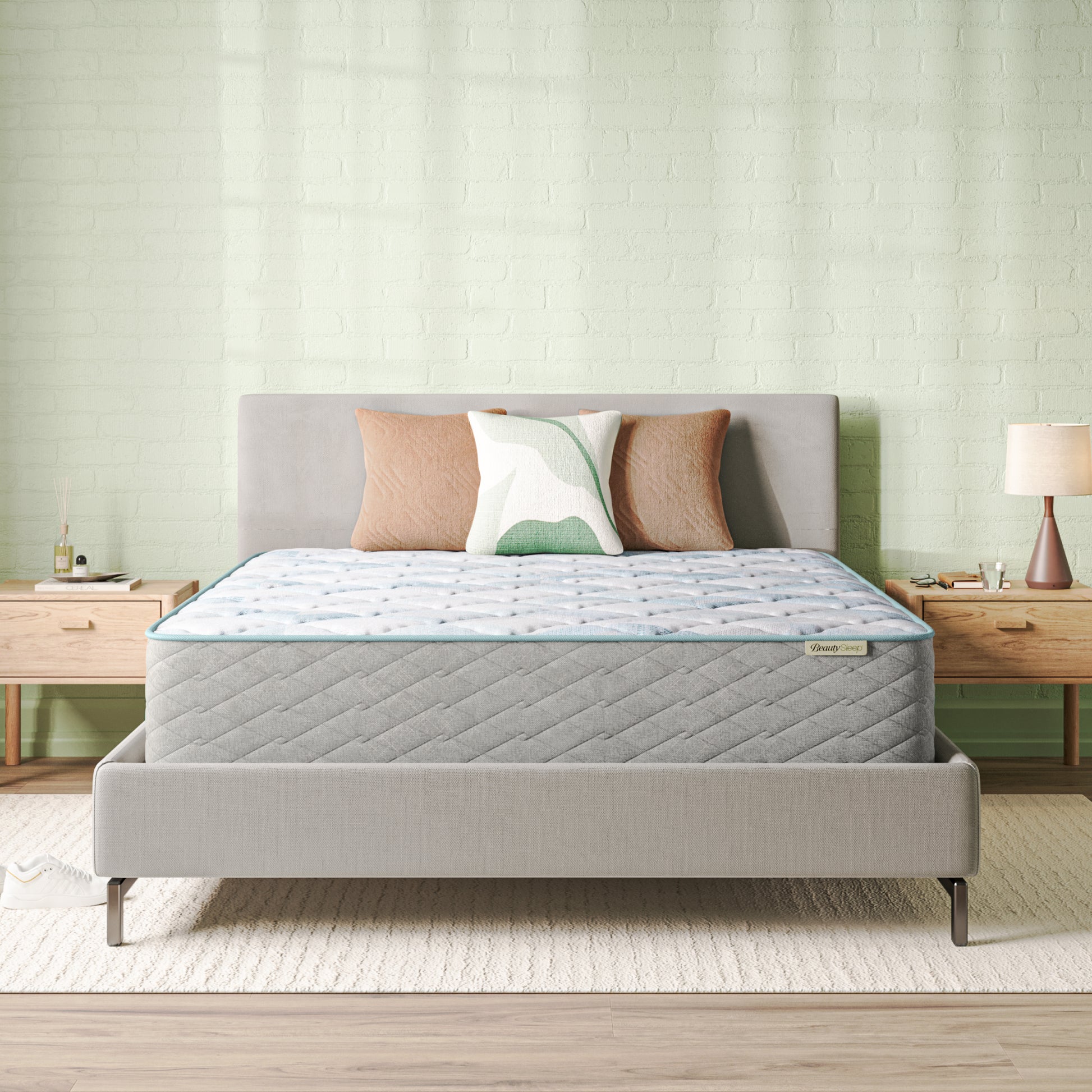 Beautysleep Mattress in a grey bedframe with 3 pillows on top of it within a bedroom setting
