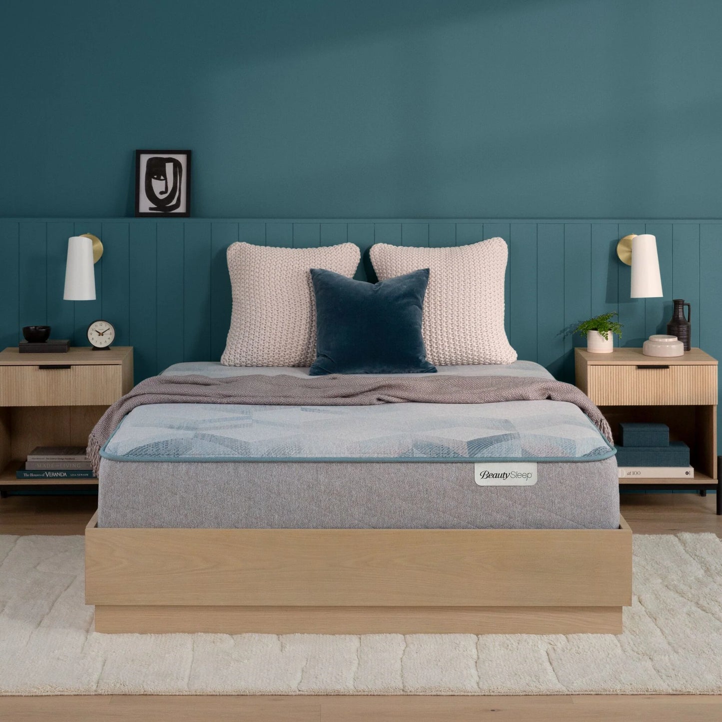 Beautysleep Mattress in a brown bedframe with 3 pillows on top of it within a bedroom setting