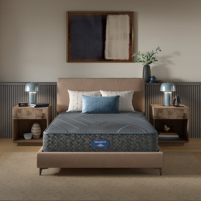 Beautyrest Hybrid Plush Mattress mattress sitting in a beige bed frame with 3 pillows on top of it