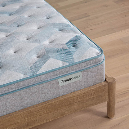 Beautysleep by Beautyrest mattress Gray quilted mattress on a wooden bed frame with 'BeautySleep' branding.